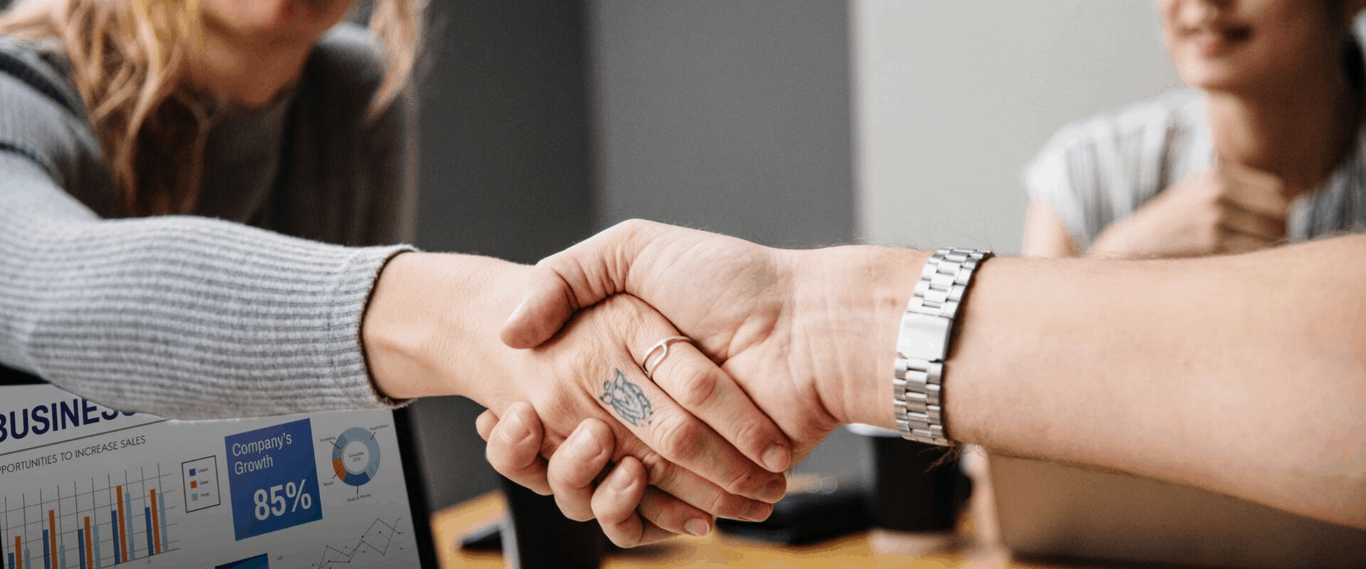 A Man and a Woman Shaking Hands - FastExpert